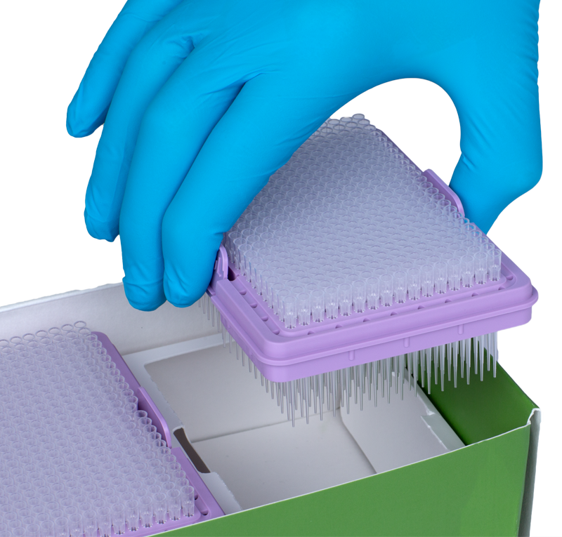 Scientist taking a GREEN CHOICE refill insert with pipette tips out of the packaging