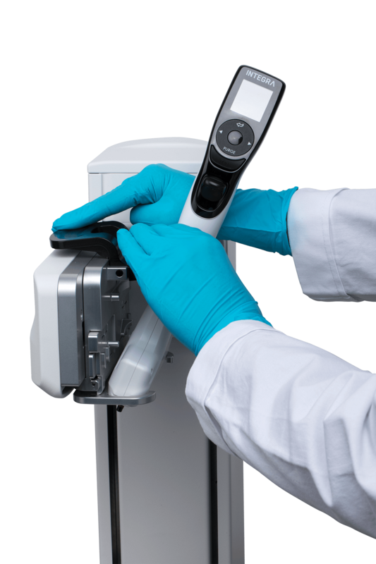 Scientist attaching their multichannel pipette to the ASSIST PLUS pipetting robot.